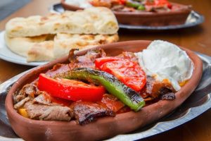 Iskander is a special Turkish dish served with bread and Yogurt